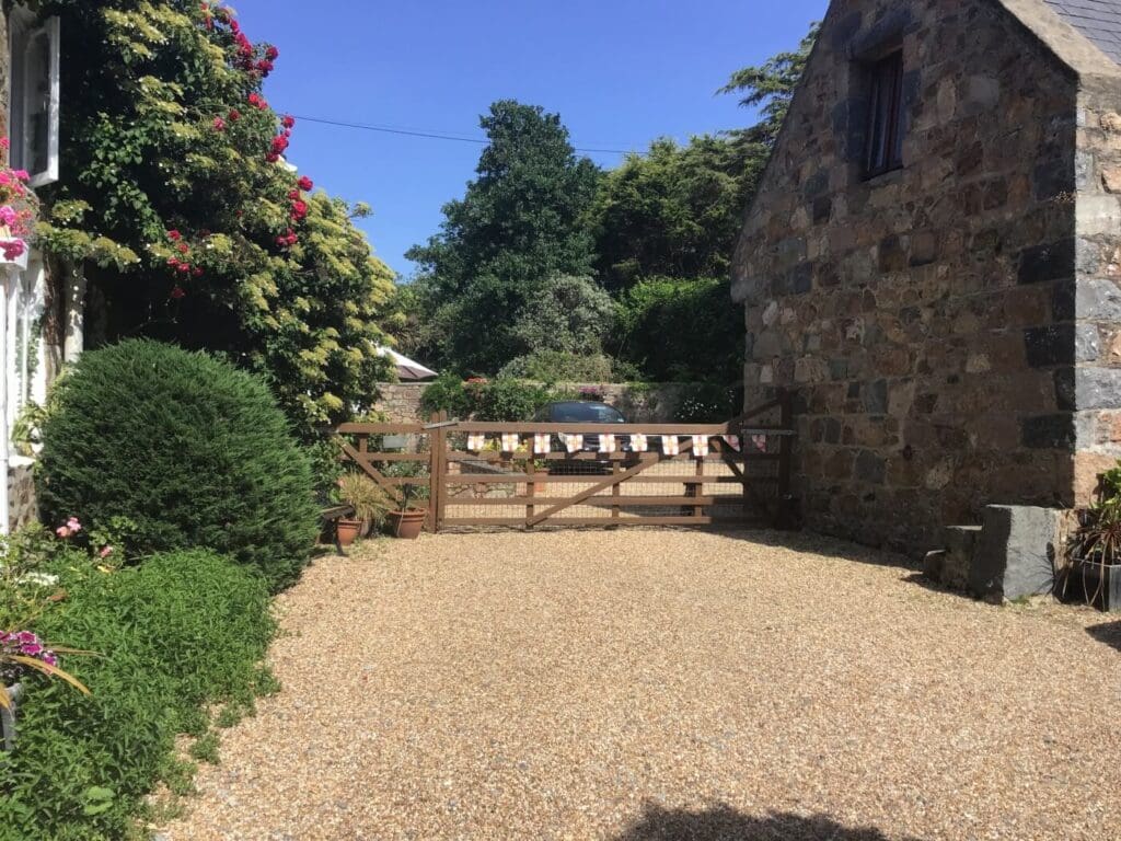 Wooden gate and driveway at La Pompe